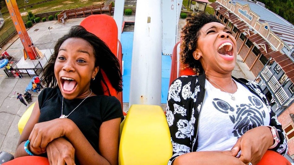 two women on a theme park ride screaming at Fun Spot America Atlanta