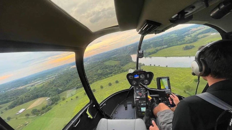 View of the cockpit of a scenic helicopter looking out over the smoky mountains