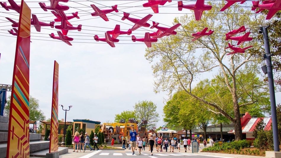 Airplanes strung up like garland over a walkway at carowinds