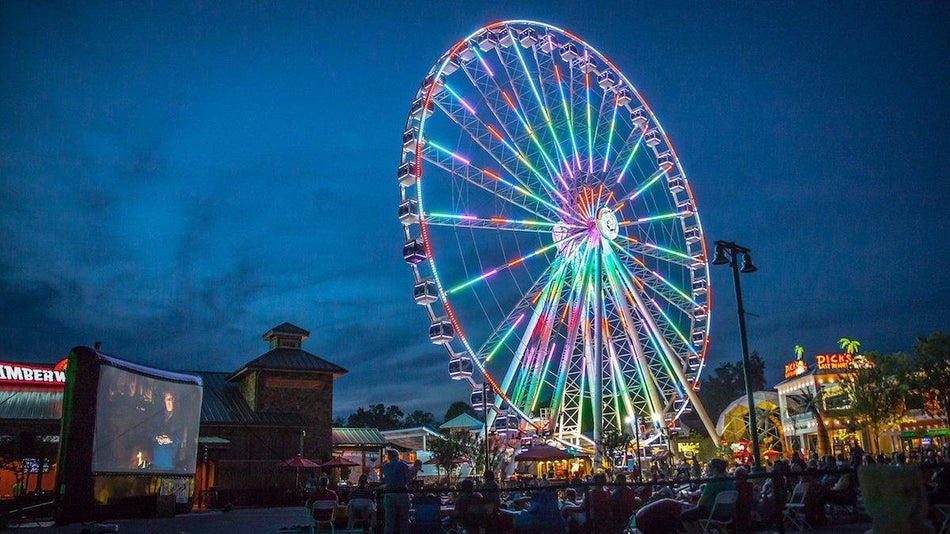 Colorful ferris wheel lit up at night in pigeon forge tennessee