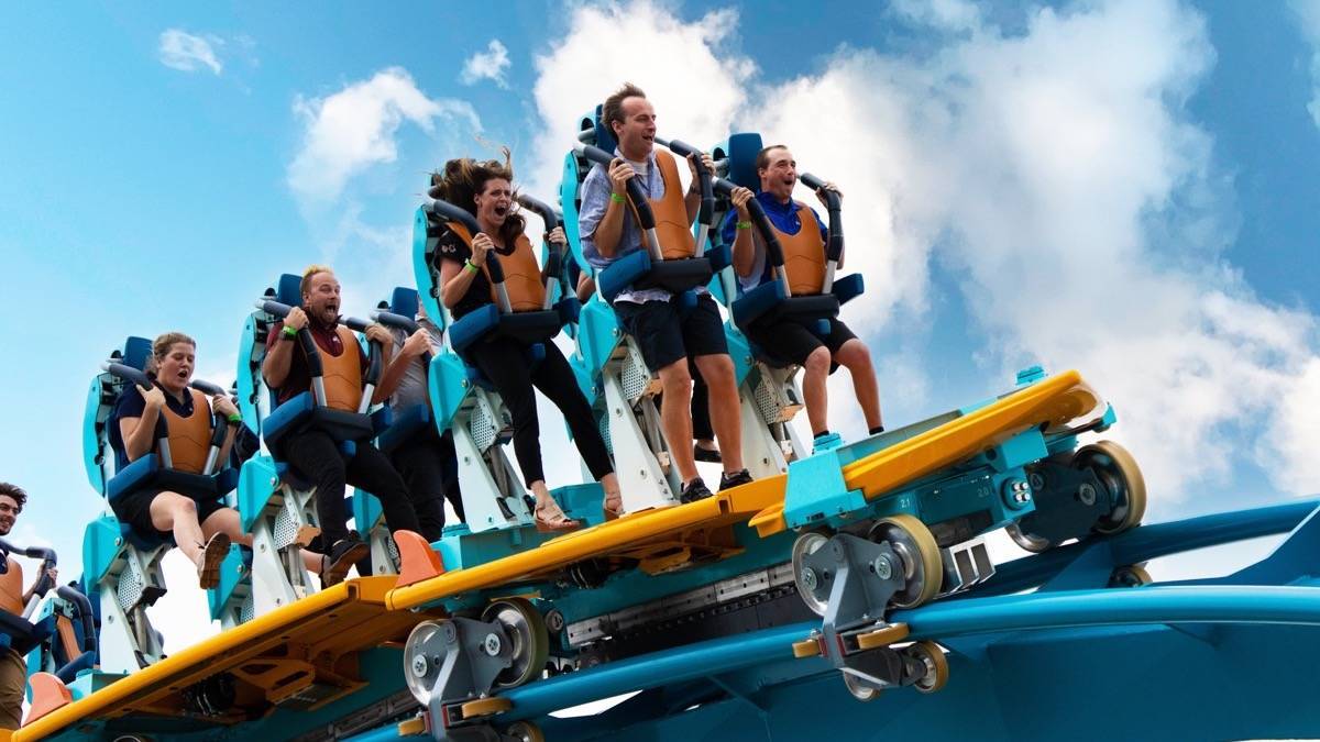 Riders in the standing position on the new Pipeline Surf Coaster at SeaWorld Orlando