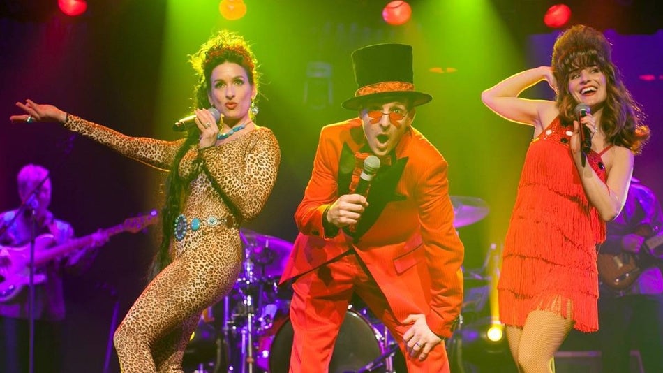 Performers on stage in hats in the comedy jamboree show