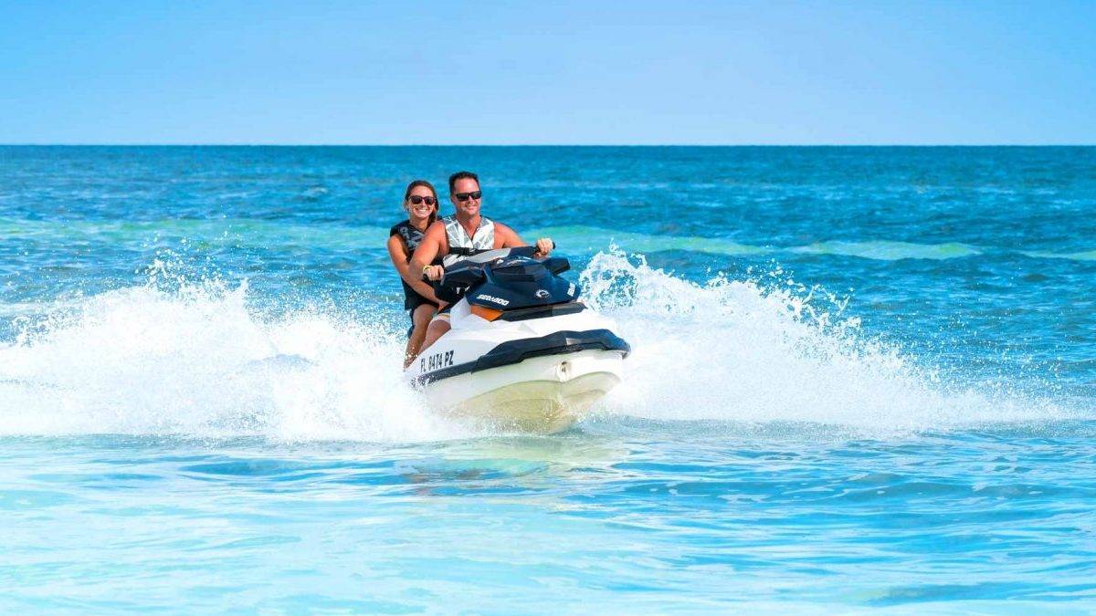 Two people on a jet ski in the oceam
