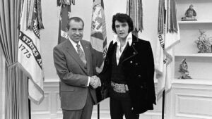old image of President Nixon shaking hands with Elvis Presley