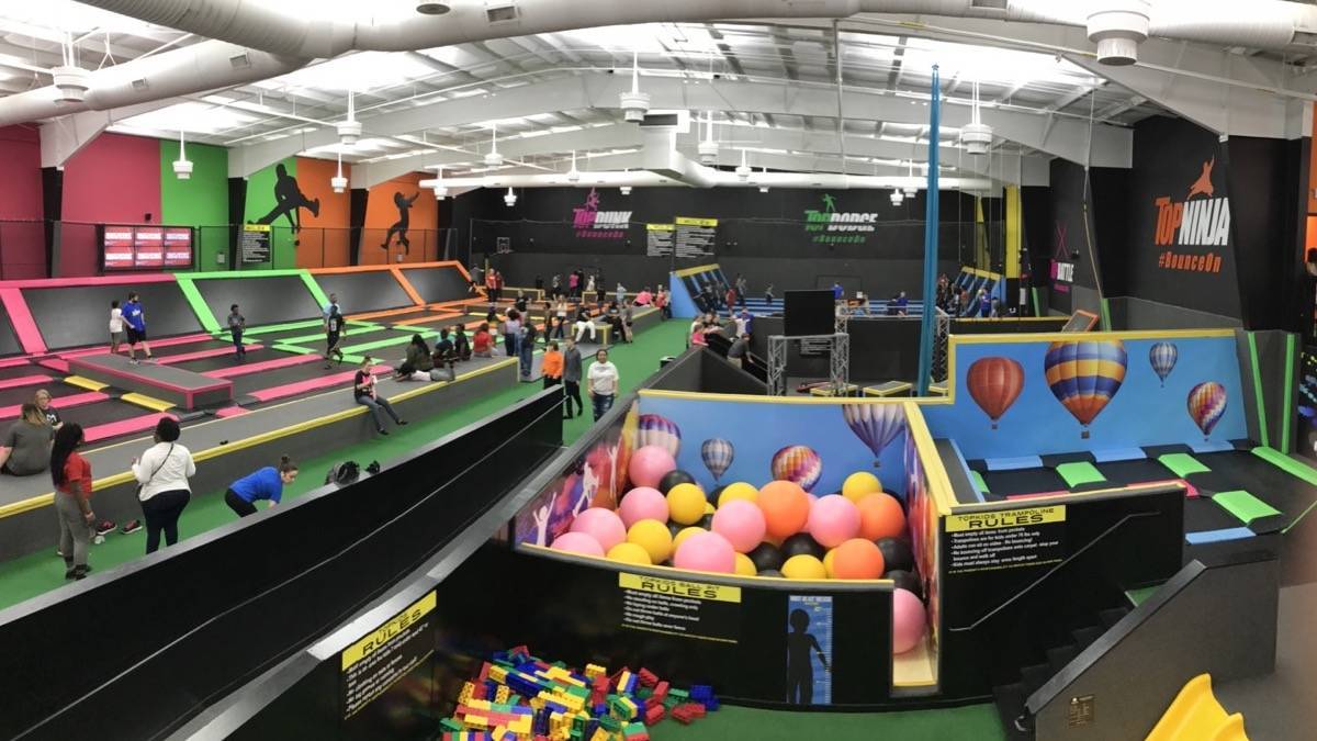 Wide shot of interior ball pit, and trampolines at TopJump in Pigeon Forge