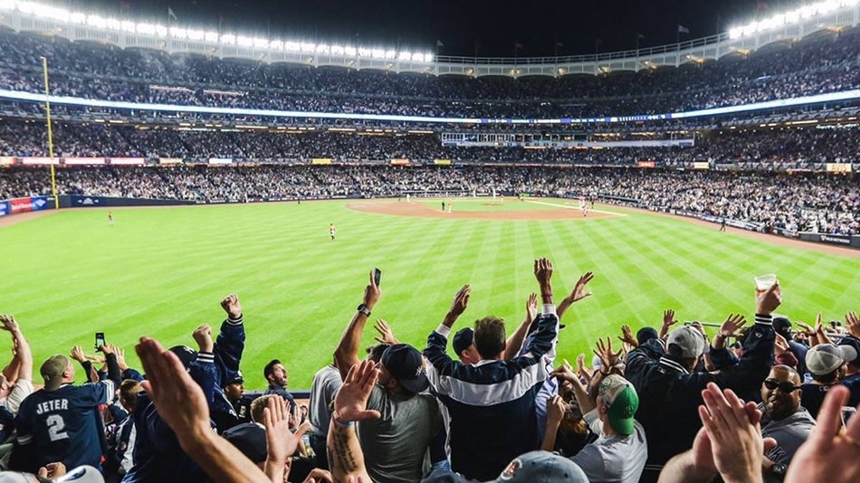 Wide angle of the yankees stadium with fans cheering
