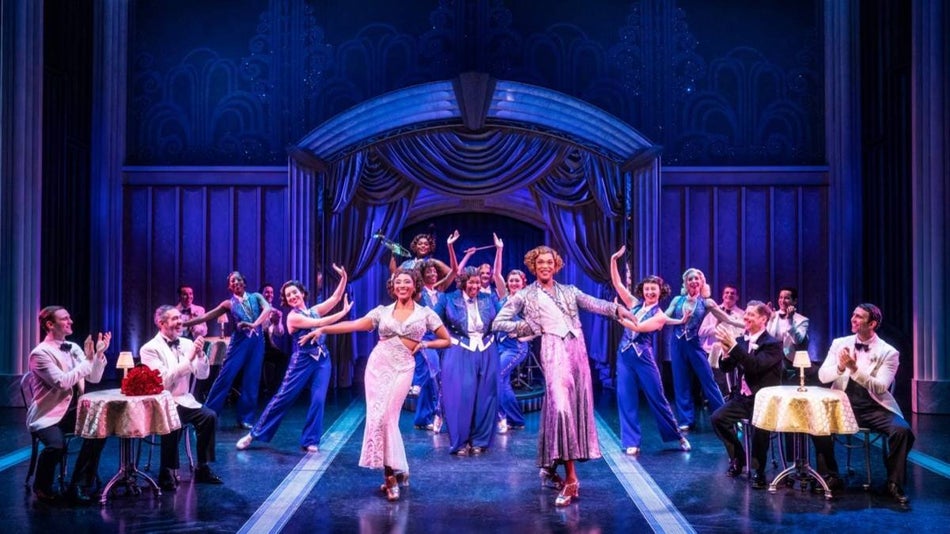 Cast members on a stage performing for Some Like it Hot