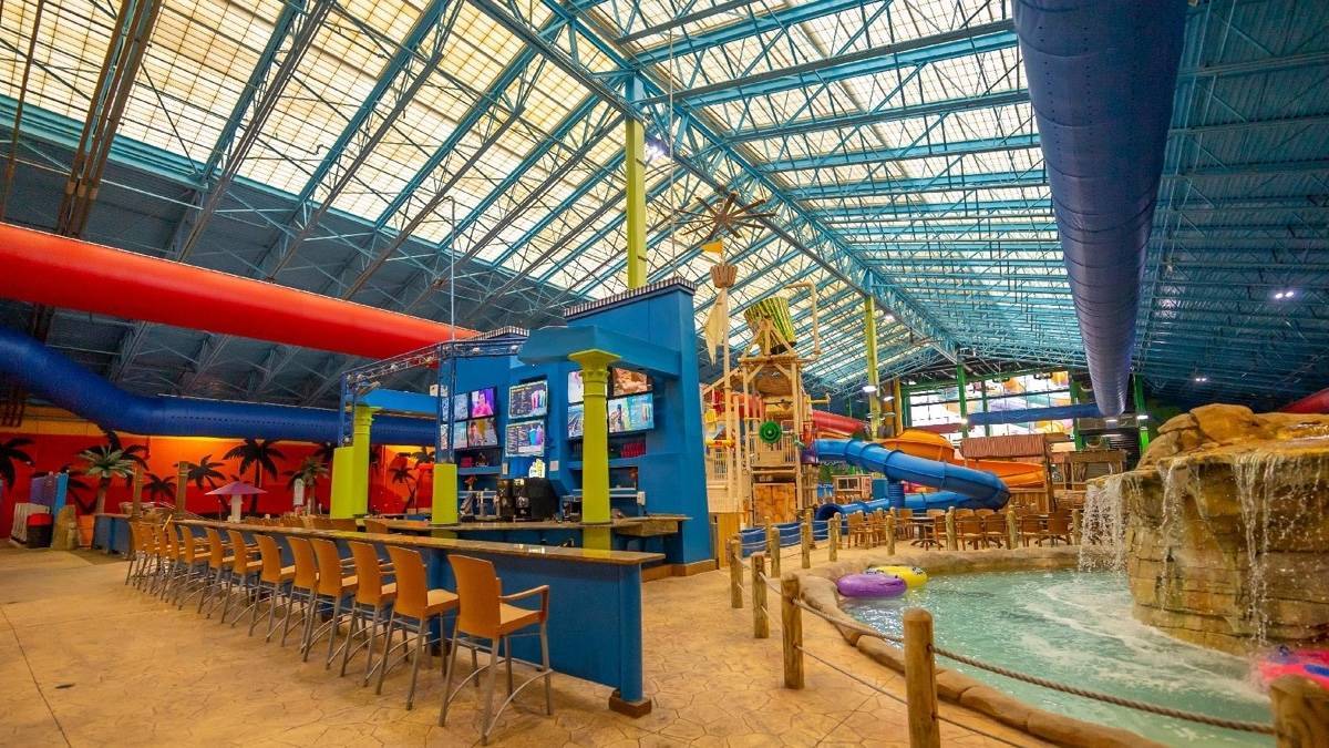 Indoor shot of a bar area and a lazy river at Big Kahuna's