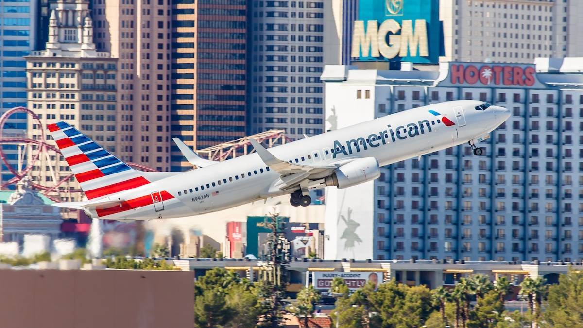 American airlines airplane taking off with the las vegas strip in the background