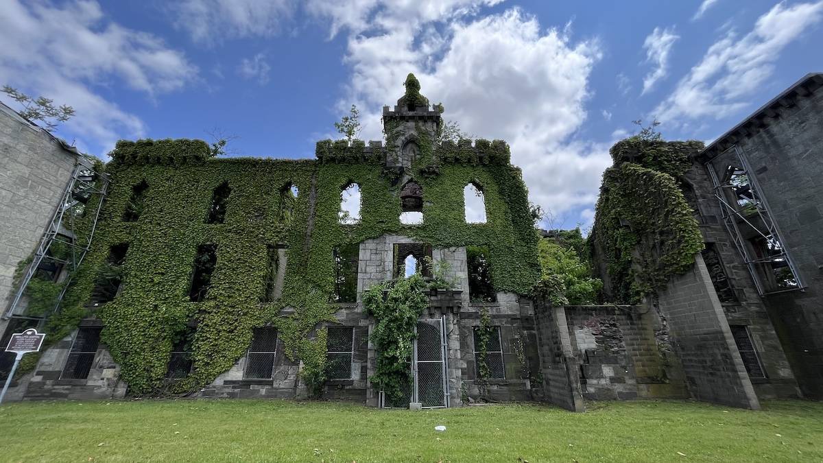 Exterior of a vine covered abandoned small pox hospital