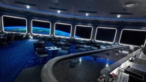Wide shot of the dining room of space 220 with what looks like space and earth out the windows