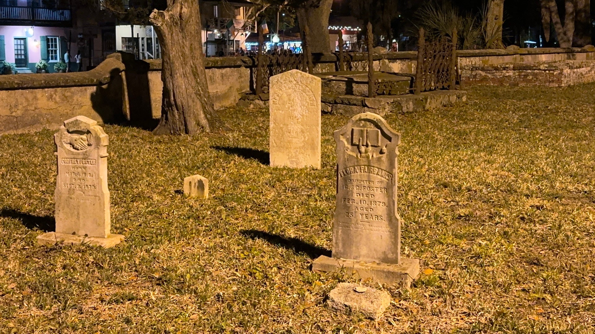 Gravestones in a cemetery at night