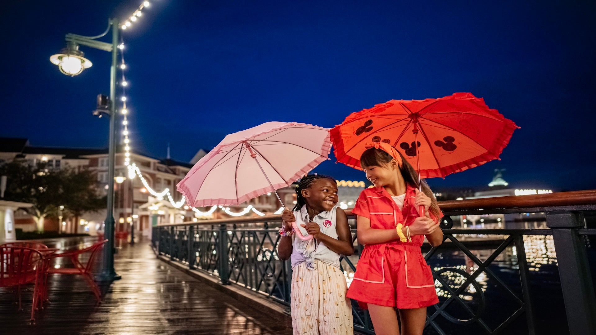 kids with umbrella at Disney BoardWalk