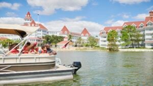 family cruising at the lake of Disney Grand Floridian Resort & Spa