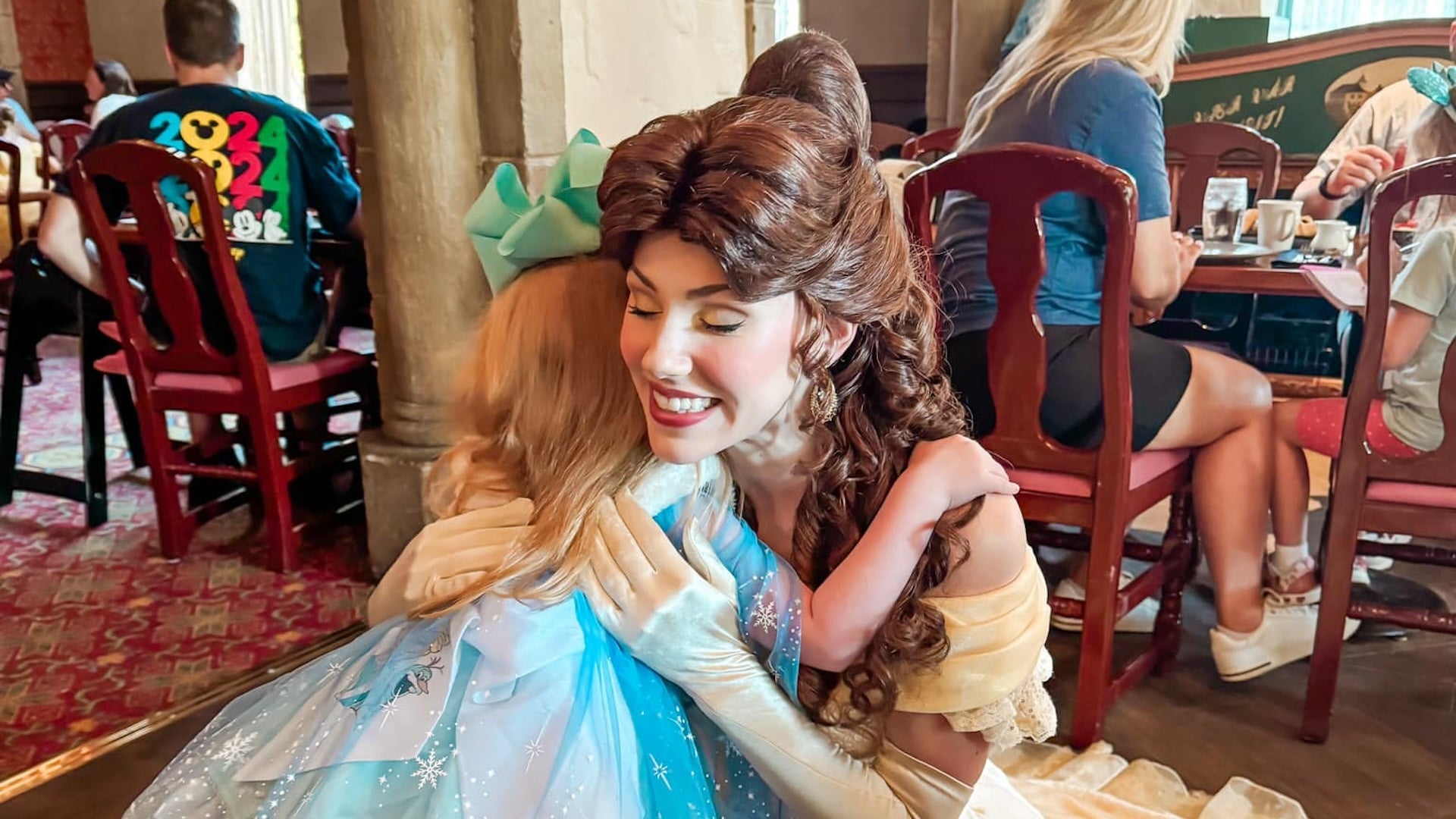 Belle princess from Akershus Royal Banquet Hall with a kid dressed up as a princess