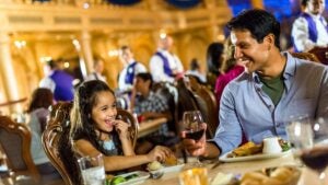 father and daughter dining at Be Our Guest Restaurant