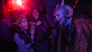 Scare actor scaring a group of people