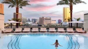 Woman in a pool overlooking the Las Vegas strip