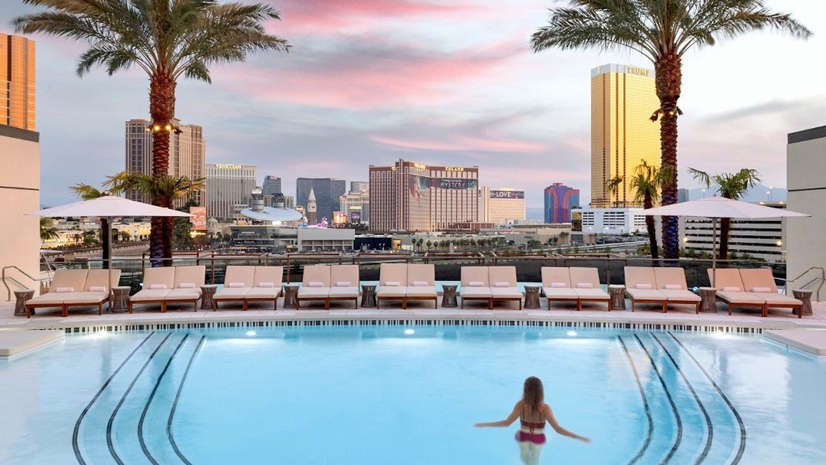Woman in a pool overlooking the Las Vegas strip