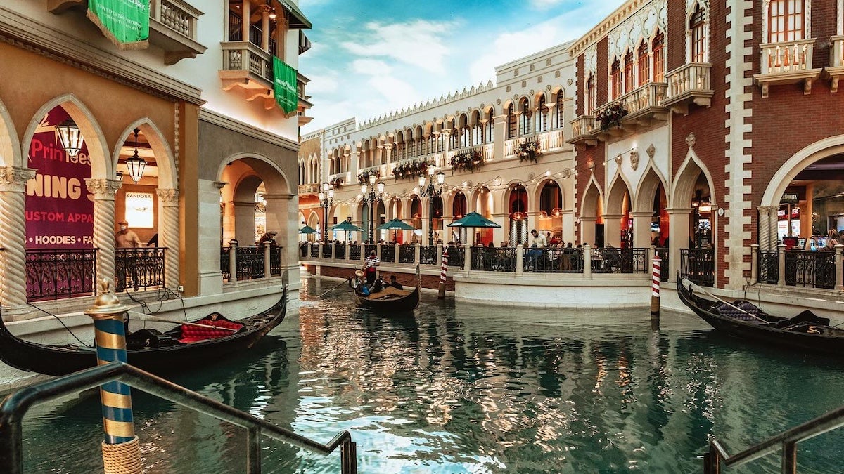 Canal winding through Italian like shops at the Venetian in Las Vegas