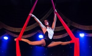 Aerial performer on red silks at Teatro Martini in Orlando