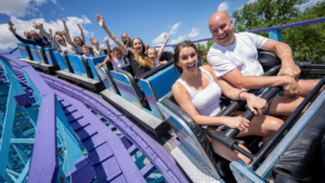 Family enjoying a thrilling blue coaster ride at Dutch Wonderland
