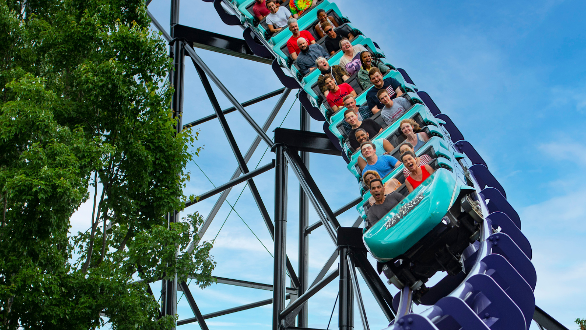 Group of people riding Kennywood’s blue roller coaster