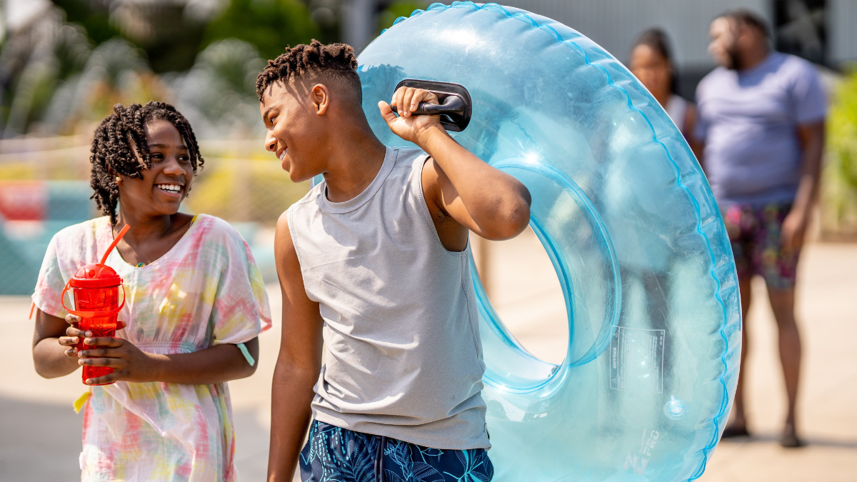 Two boys walking and chatting at Noah’s Ark Waterpark.