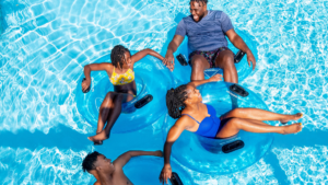 Family floating and relaxing in the lazy river at Wet’n Wild Emerald Pointe.