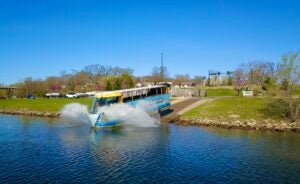 Amphibious vehicle driving from land into a lake