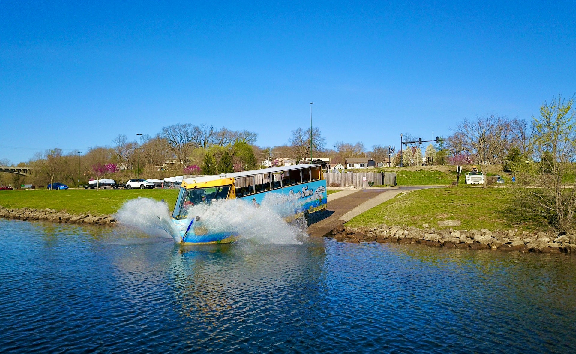 Amphibious vehicle driving from land into a lake