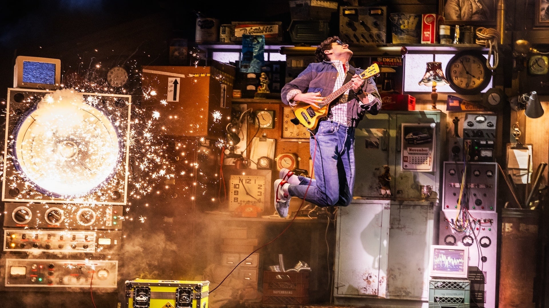 a man strumming his guitar