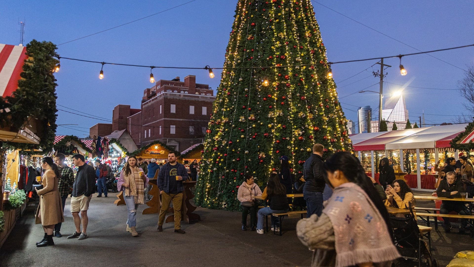 Christmas tree with many people at Christkindl Market Atlanta