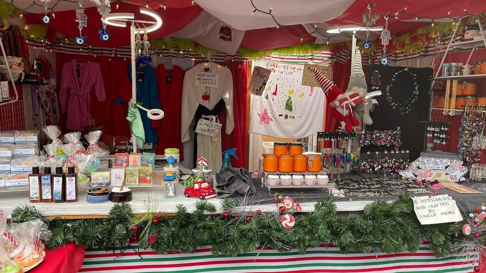 store booth at Christkindl Market Atlanta with robes, accessories, jars