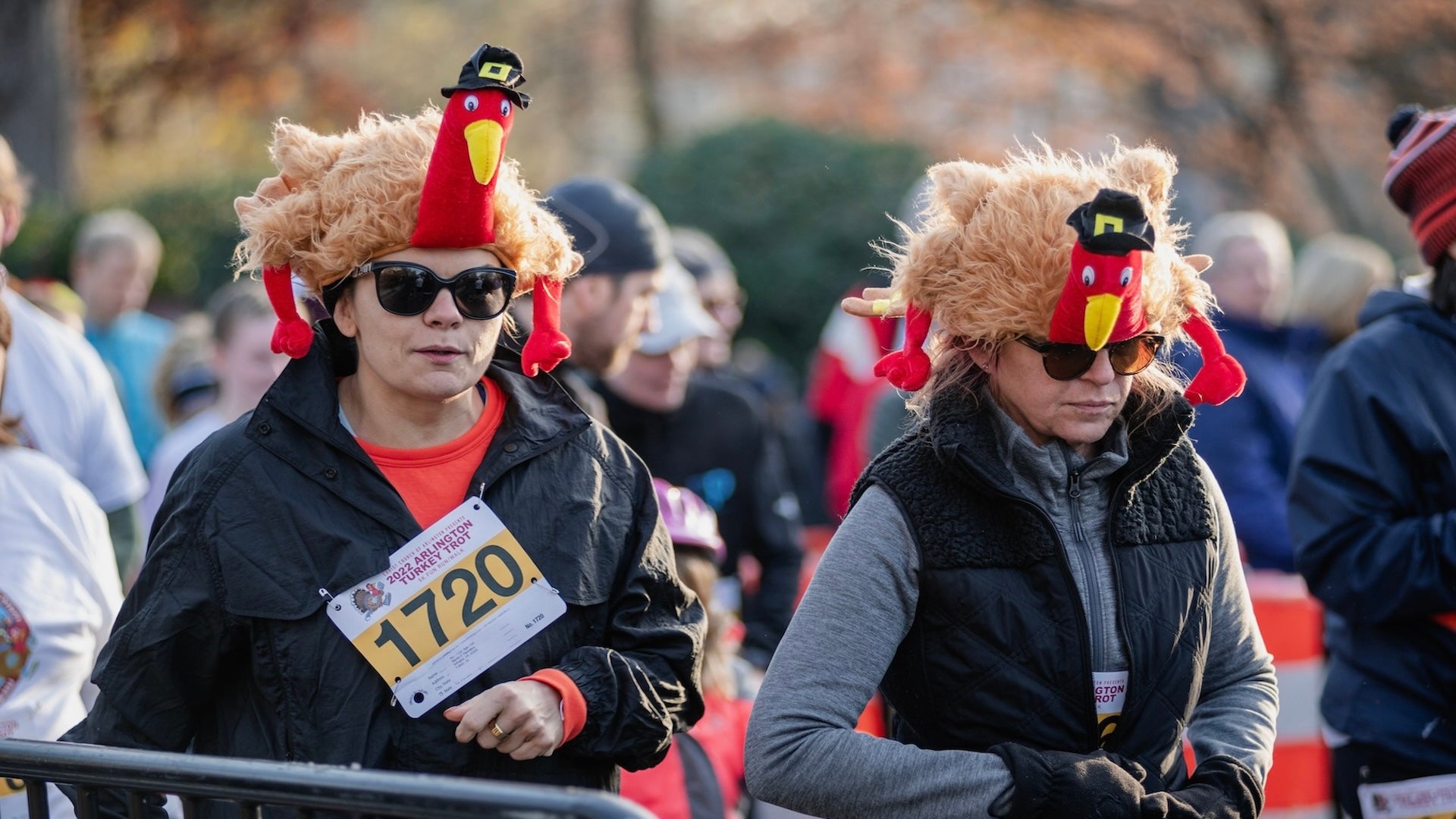 two women wearing turkey hats