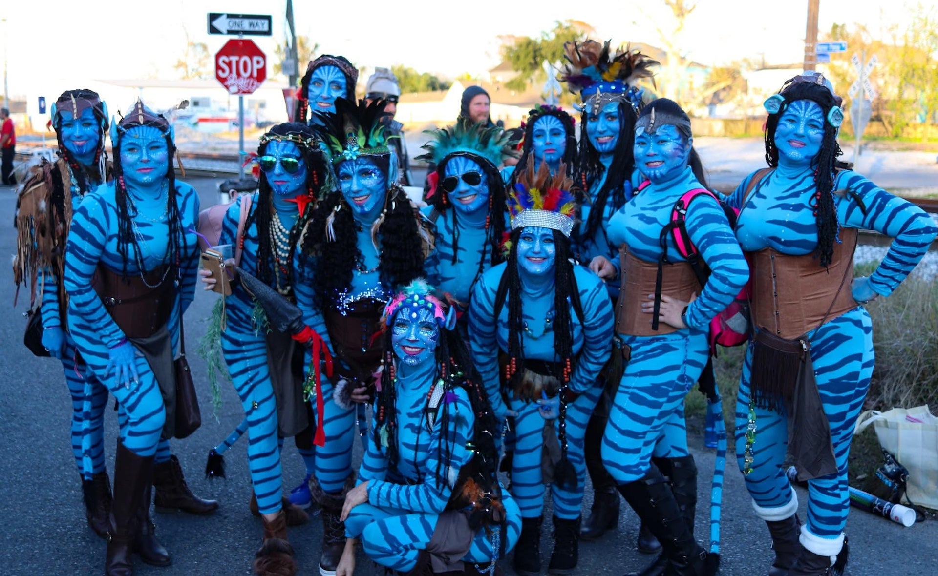 Several women dressed as Avatars posing for a group photo