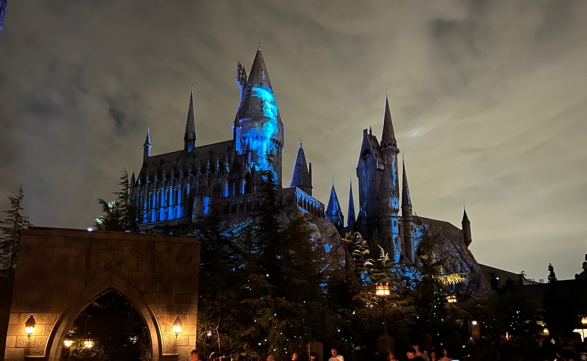 Hogwarts at night with spooky lights casting on it