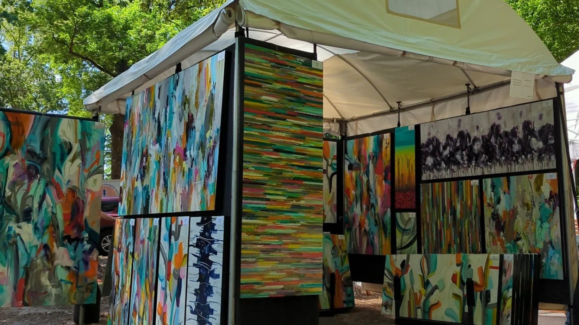 art works displayed in a booth