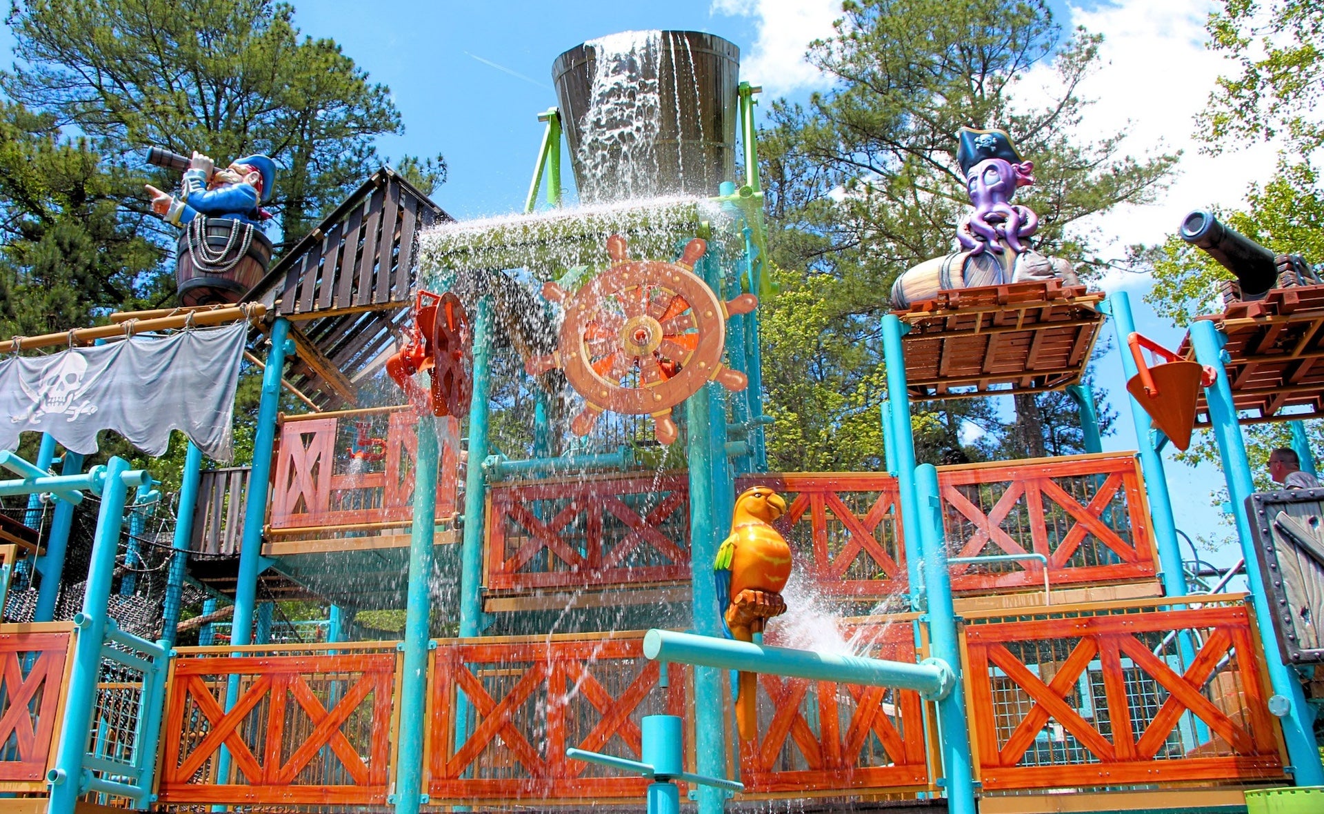 Large water park apparatus with pirate themed characters on it