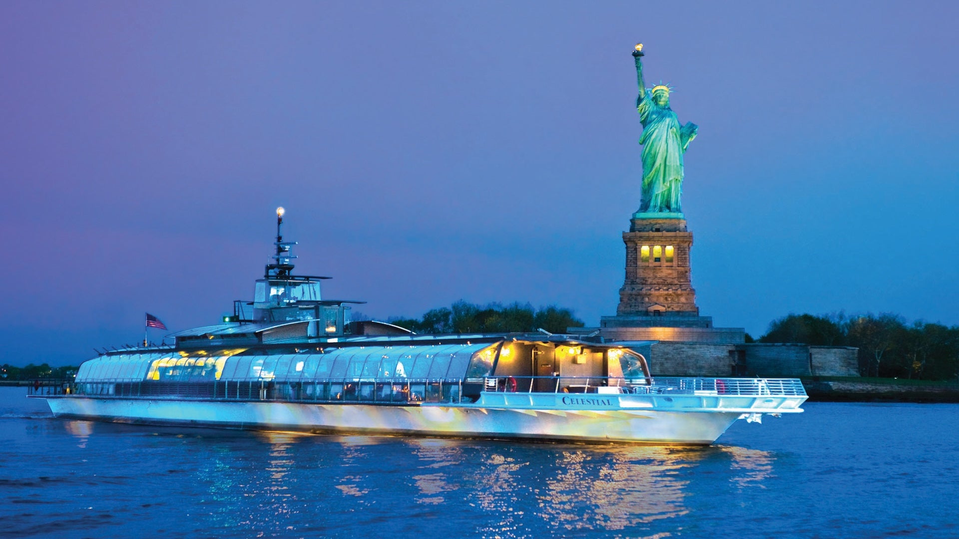 a boat in front of Statue of Liberty