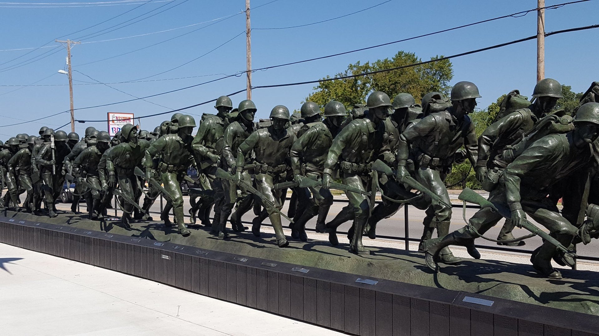 Memorial of ww2 era soldiers marching outside of a museum in Branson