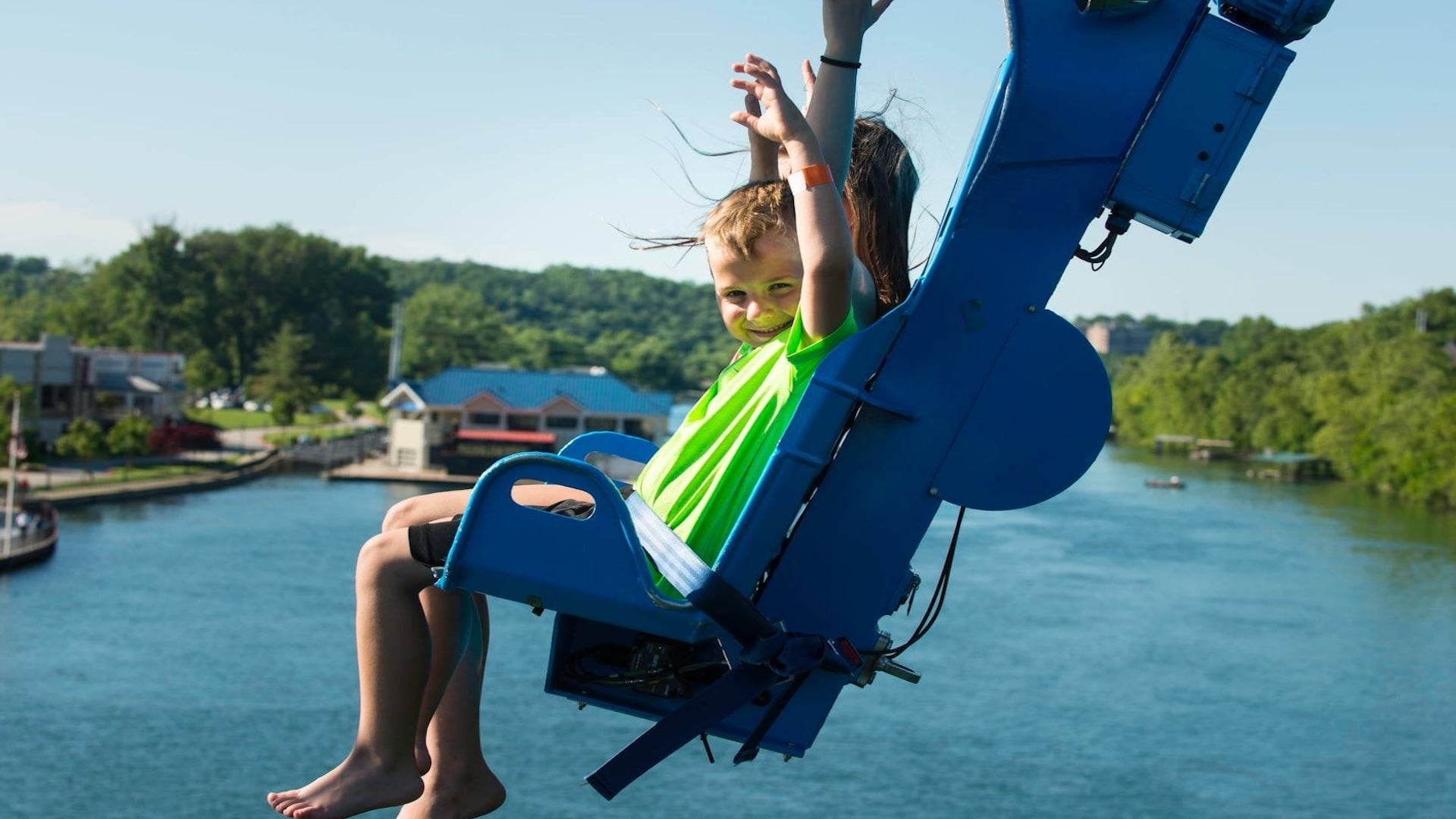 two kids riding a zipline