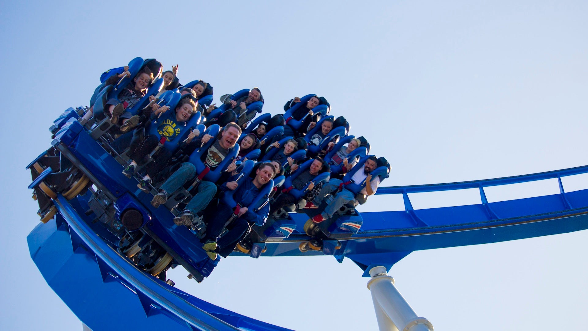 Blue Roller coaster with riders