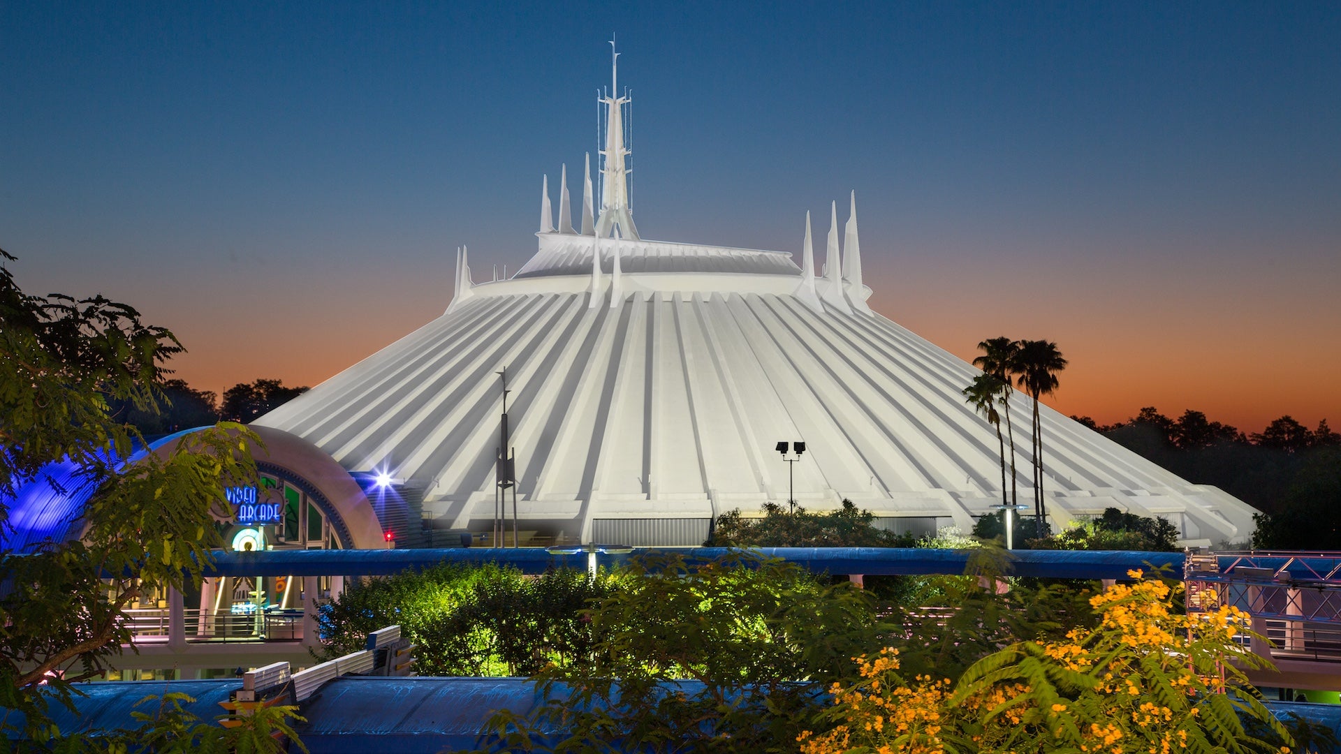 White roof of an indoor roller coaster at Disney World at sunset