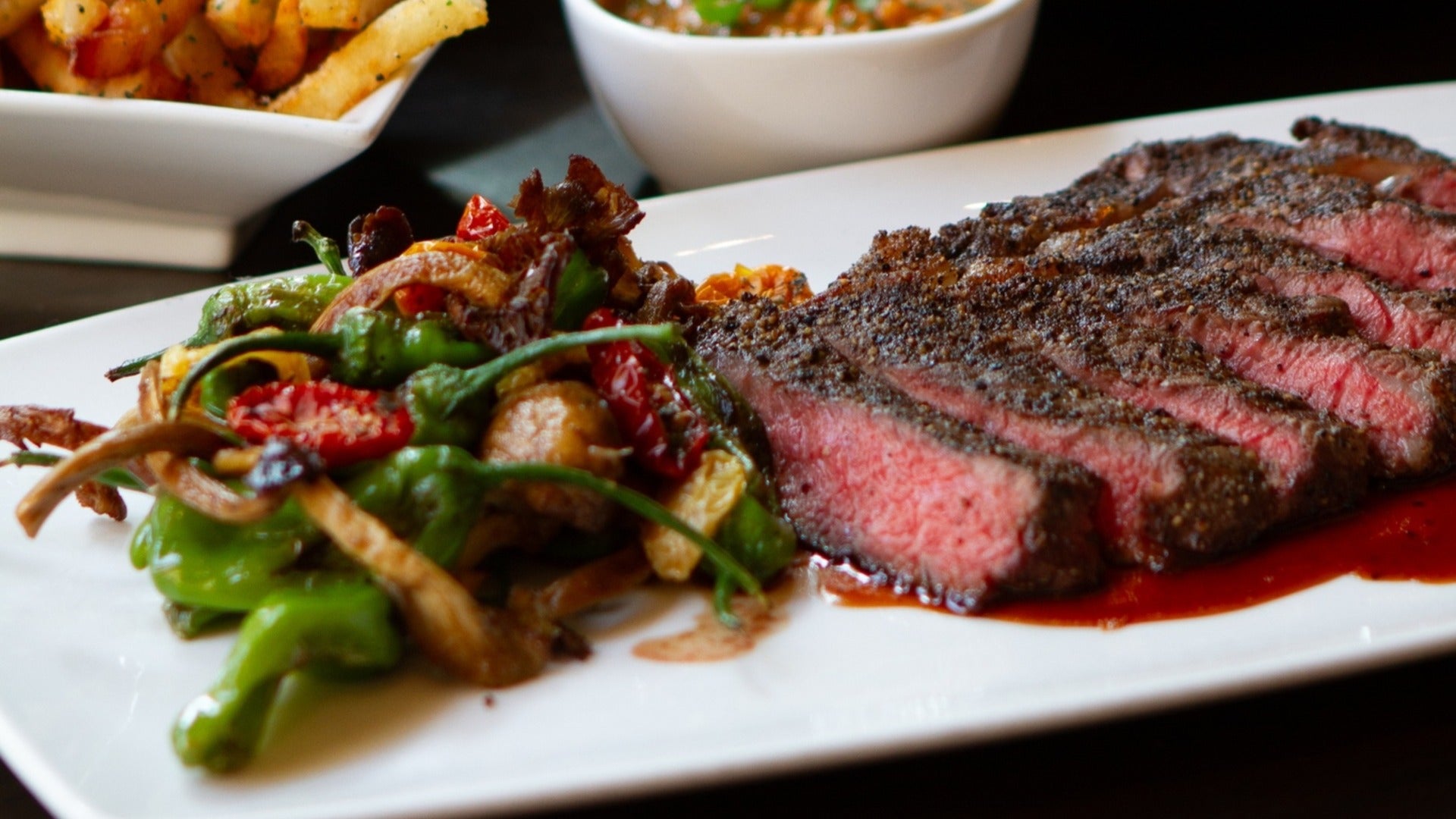 steak served with a side of vegetables