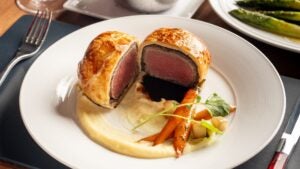 beef wellington at gordon ramsay steak restaurant at paris hotel, las vegas, plates and utensils