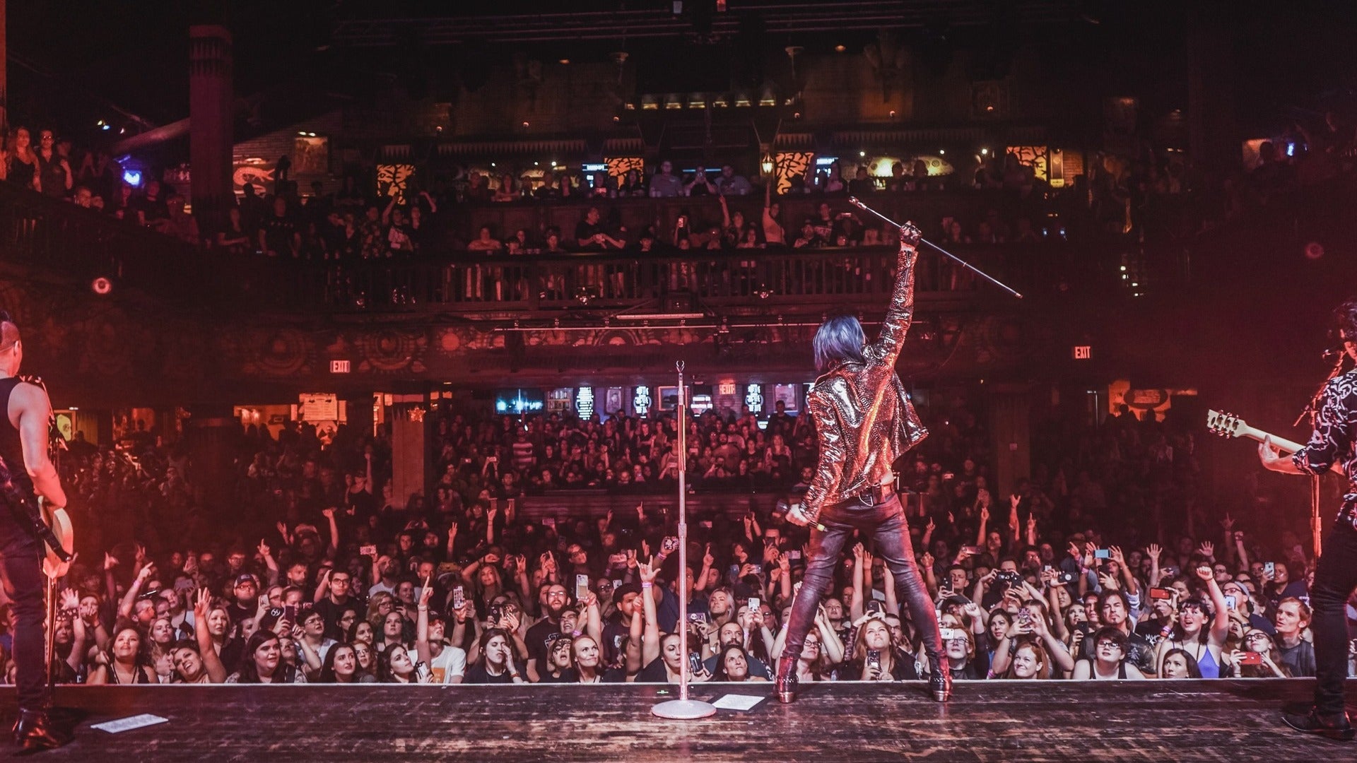 band performing on stage for an audience