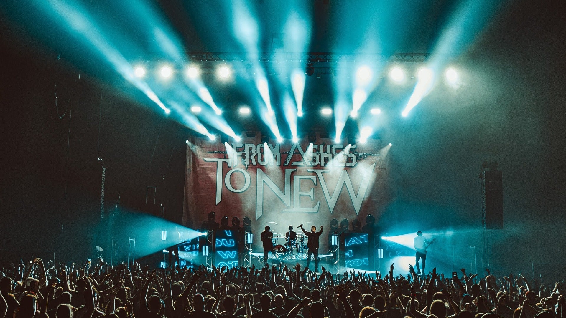 band performing on stage for an audience