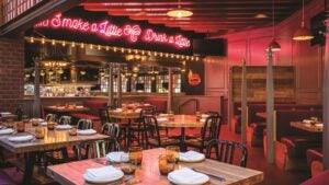 interior of international smoke restaurant, neon lights and dining tables and chairs