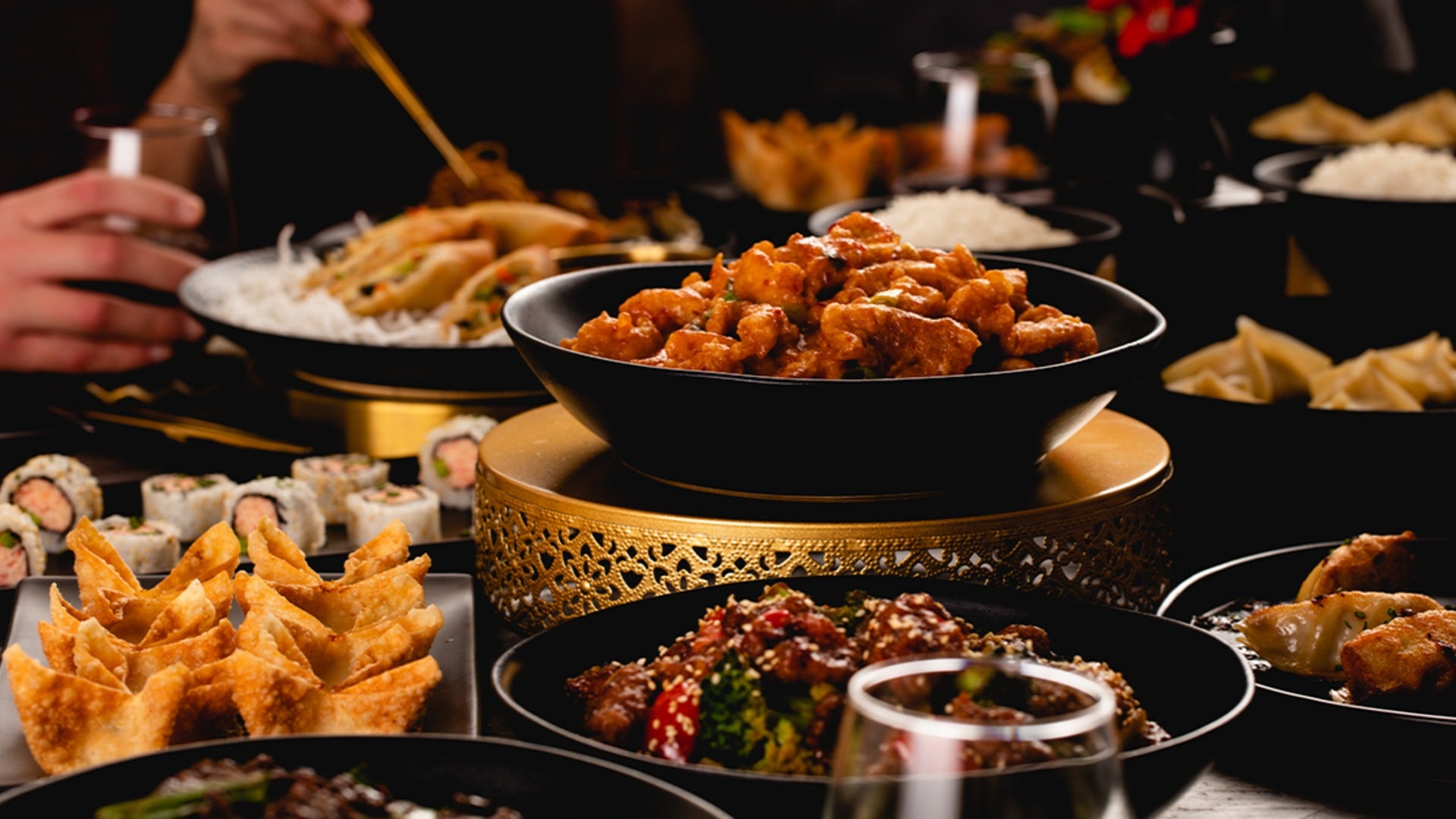 asian cuisine, food, with people enjoying it in the background